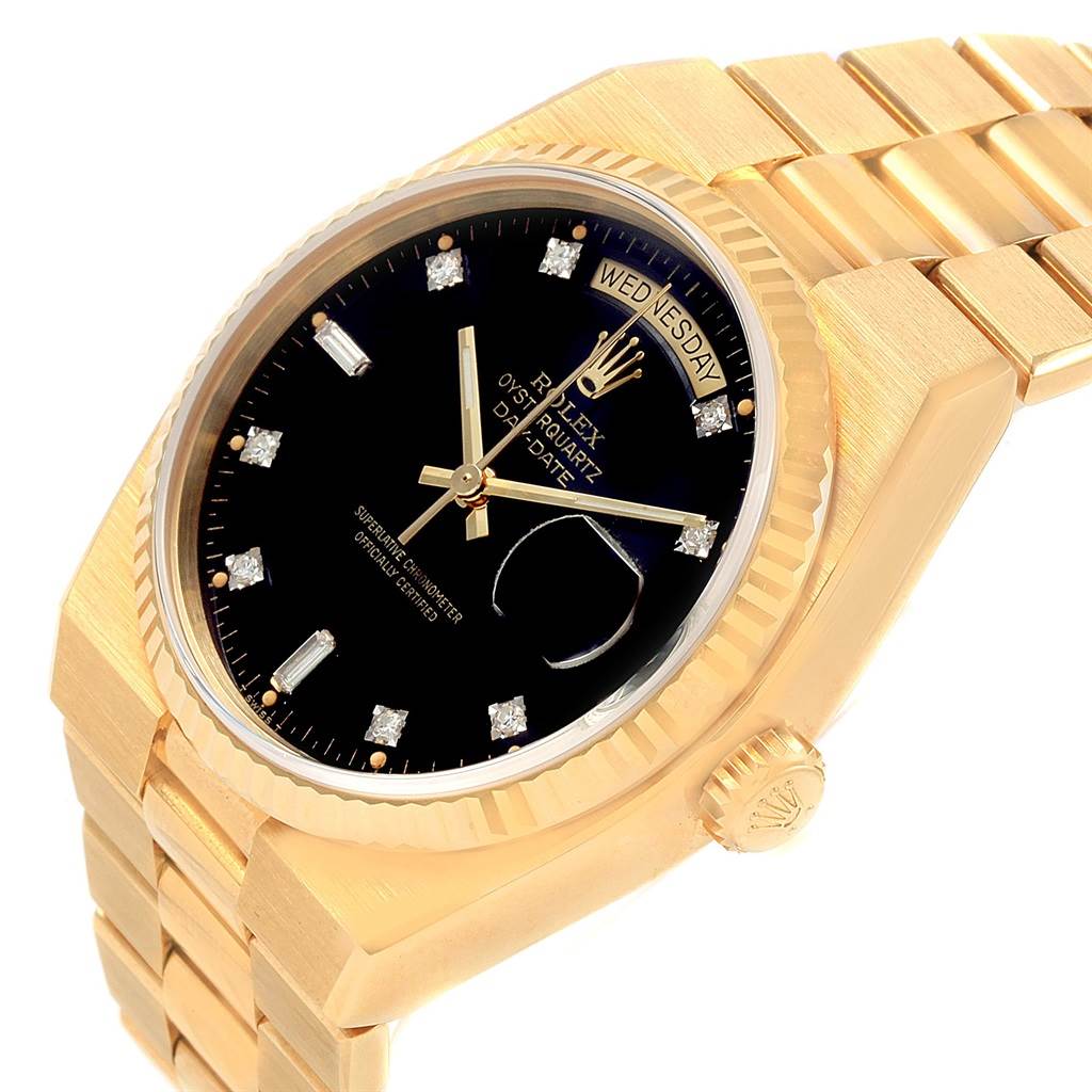 The image shows a Rolex Oysterquartz 19018 Men's Yellow Gold Black Dial 19018 Men's Yellow Gold Black Dial watch at an angle, highlighting its gold case, black dial, and diamond hour markers.