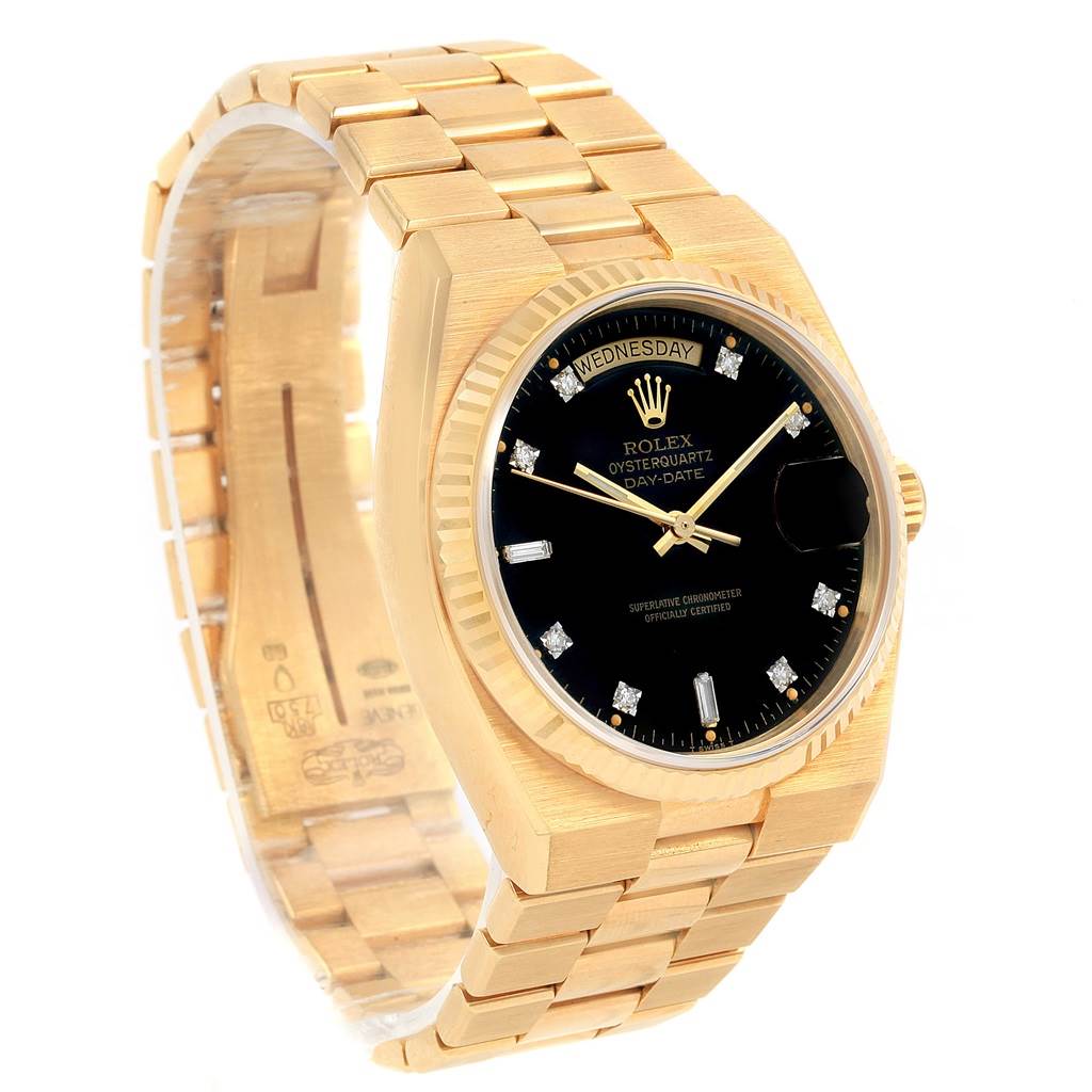 A Rolex Oysterquartz 19018 Men's Yellow Gold Black Dial 19018 Men's Yellow Gold Black Dial watch is shown at a slight angle, highlighting its gold bracelet, black dial, and day-date display.