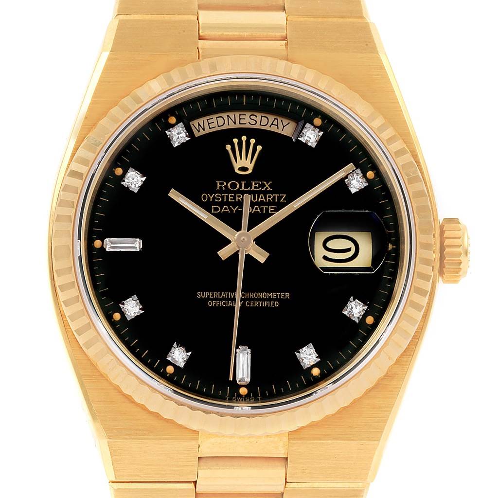 The image shows a top-down view of a Rolex Oysterquartz 19018 Men's Yellow Gold Black Dial 19018 Men's Yellow Gold Black Dial watch, highlighting its black dial, day-date display, and gold bracelet.