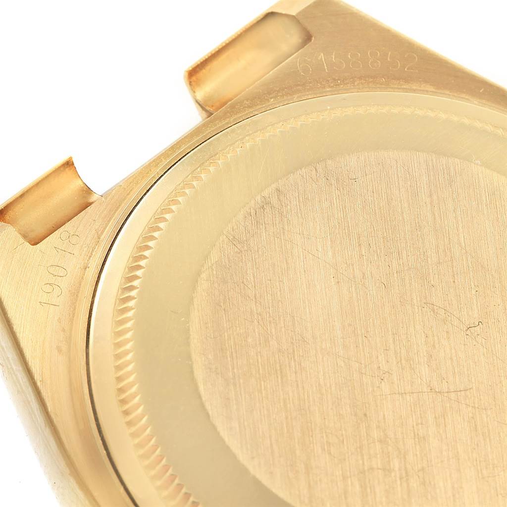 This close-up image shows the case back and part of the lugs of a Rolex Oysterquartz 19018 Men's Yellow Gold Black Dial 19018 Men's Yellow Gold Black Dial watch.