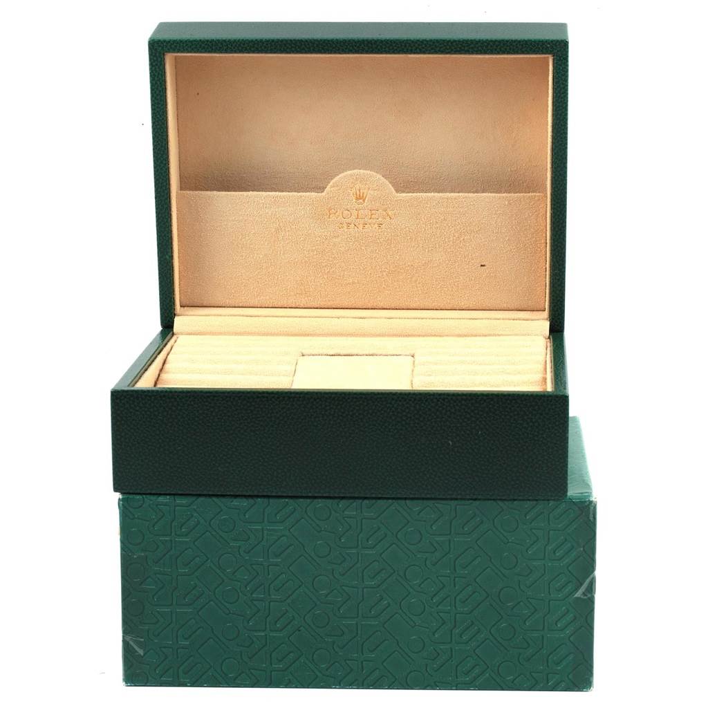 This image shows an open, empty Rolex Oysterquartz 19018 Men's Yellow Gold Black Dial 19018 Men's Yellow Gold Black Dial watch box with a green exterior and beige interior.