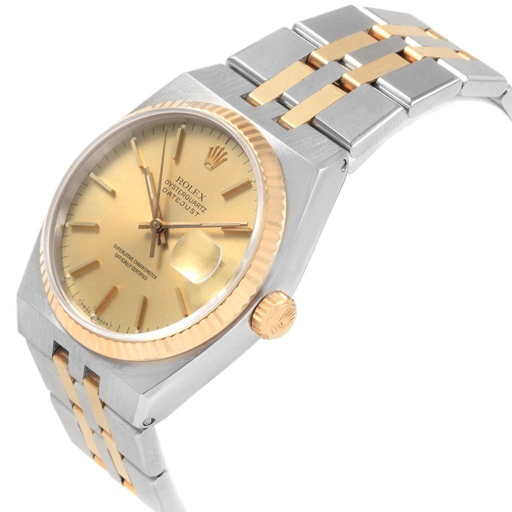 The image shows a close angle of a Rolex Oysterquartz 17013 Men
s Stainless Steel Champagne Dial 17013 Men
s Stainless Steel Champagne Dial watch, highlighting the gold dial, crown, and two-tone bracelet.