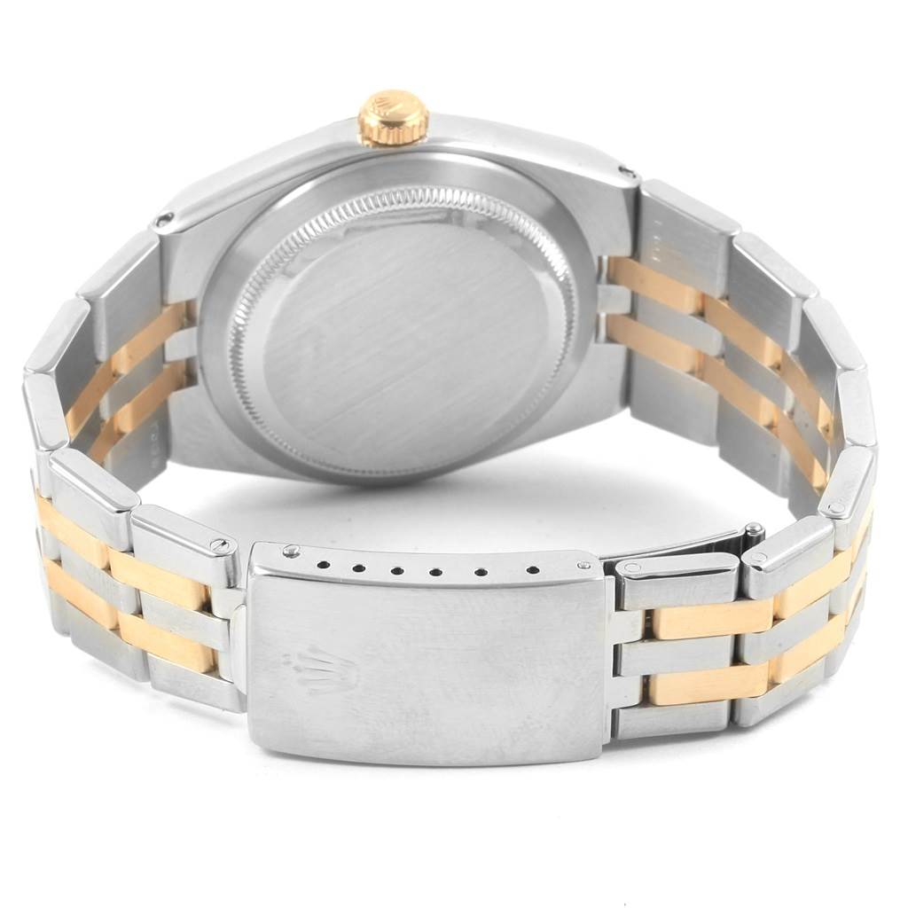 The image shows the back case and bracelet of a Rolex Oysterquartz 17013 Men
s Stainless Steel Champagne Dial 17013 Men
s Stainless Steel Champagne Dial watch, highlighting its two-tone metal design.