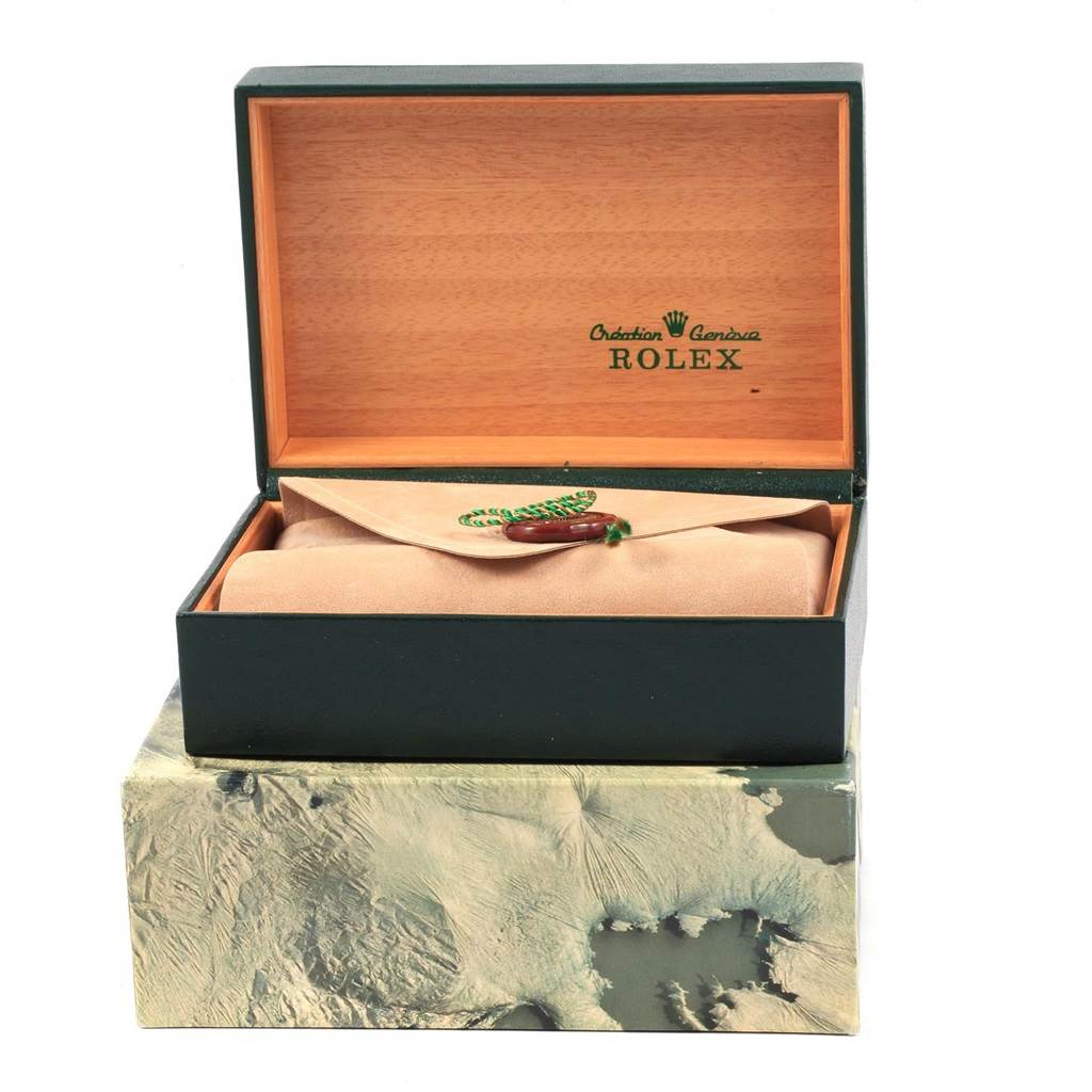 The image shows the packaging of a Rolex Oysterquartz 17013 Men
s Stainless Steel Champagne Dial 17013 Men
s Stainless Steel Champagne Dial watch, including an open wooden box with a protective pouch inside.