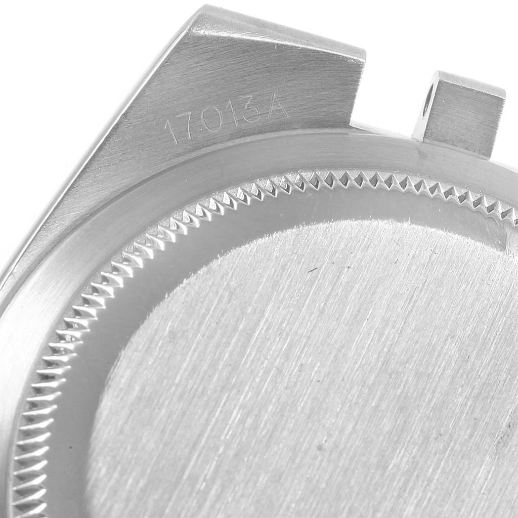This image shows a close-up of the backside of a Rolex Oysterquartz 17013 Men
s Stainless Steel Champagne Dial 17013 Men
s Stainless Steel Champagne Dial watch case, revealing part of the model number 17013A.