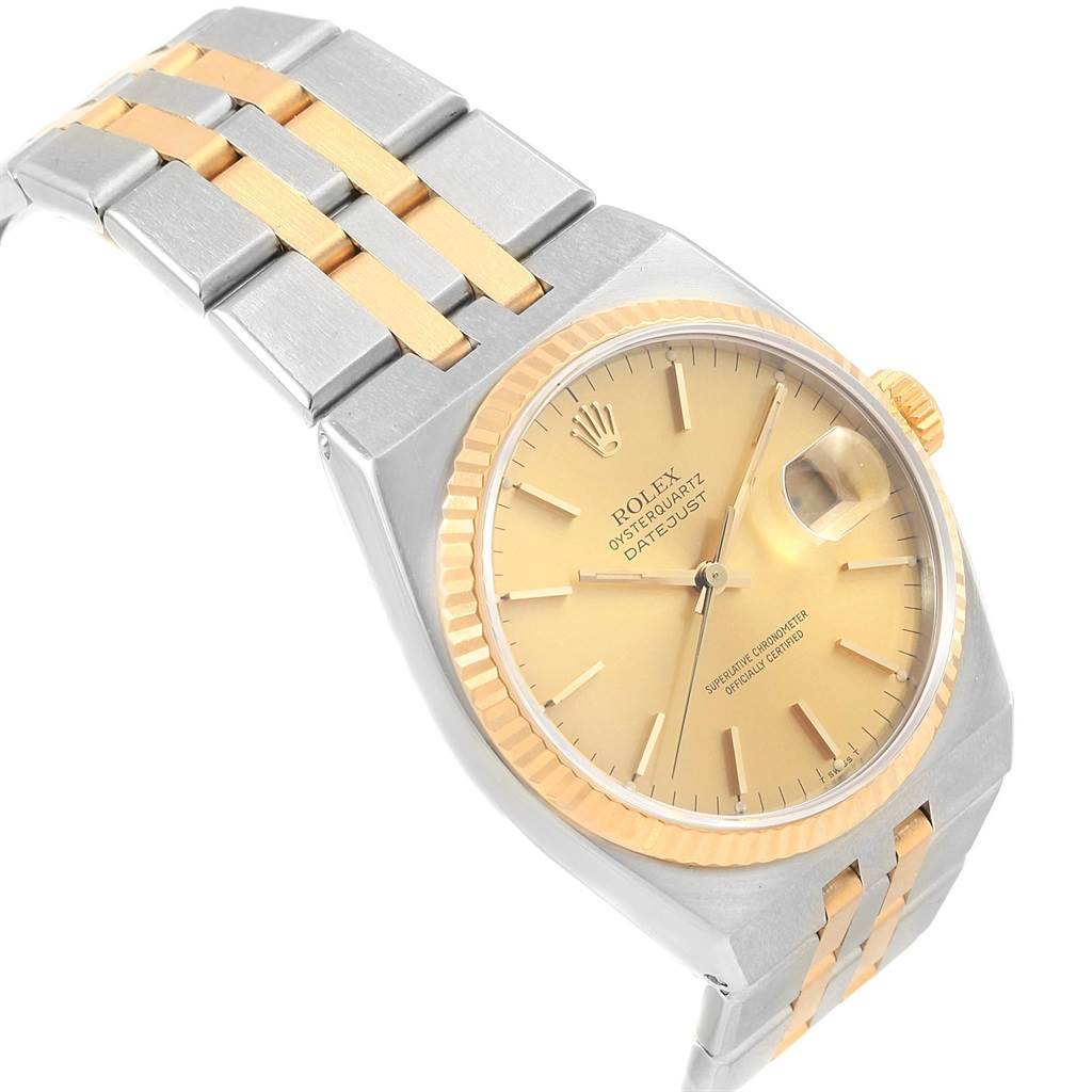 The image shows a Rolex Oysterquartz 17013 Men
s Stainless Steel Champagne Dial 17013 Men
s Stainless Steel Champagne Dial watch, angled to reveal its full face, bezel, and part of the two-tone bracelet.