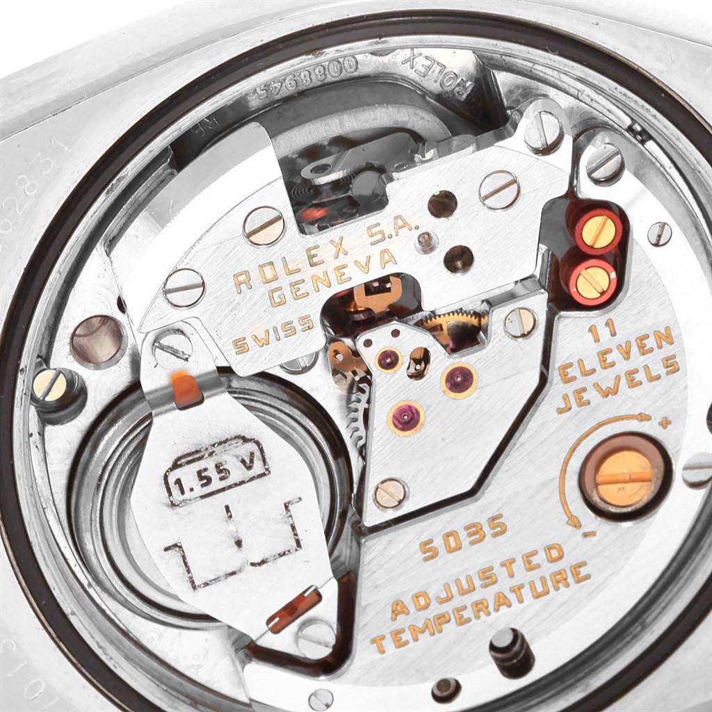 This image shows a close-up view of the movement of a Rolex Oysterquartz 17013 Men
s Stainless Steel Champagne Dial 17013 Men
s Stainless Steel Champagne Dial watch, highlighting the mechanics and inscriptions.