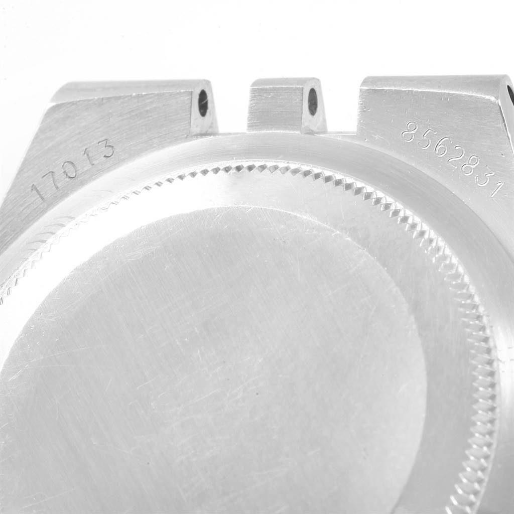 This close-up image shows the back casing and side notches of a Rolex Oysterquartz 17013 Men
s Stainless Steel Champagne Dial 17013 Men
s Stainless Steel Champagne Dial watch, model number 17013.