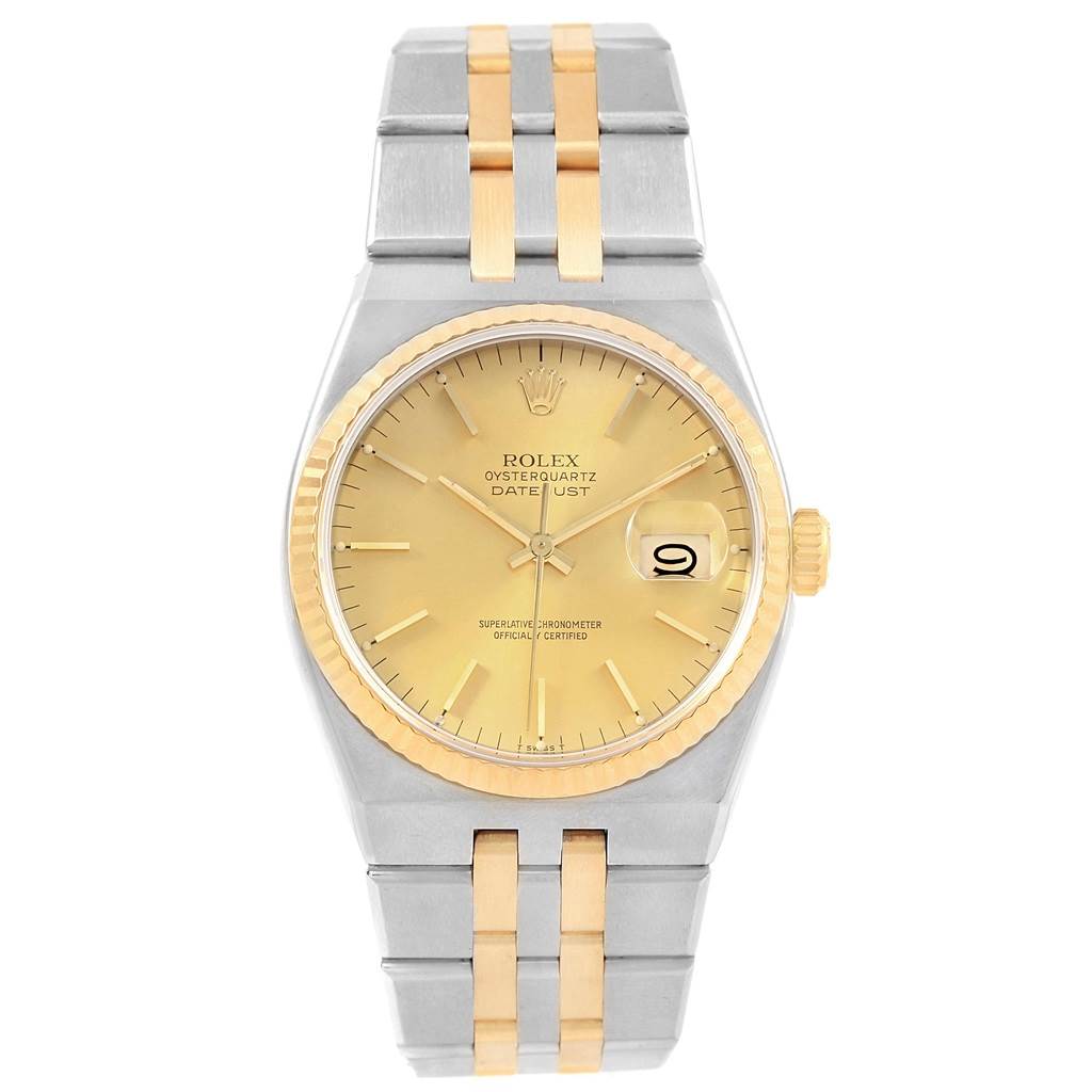 The image shows a front view of a Rolex Oysterquartz 17013 Men
s Stainless Steel Champagne Dial 17013 Men
s Stainless Steel Champagne Dial Datejust watch, highlighting its gold dial, bezel, and two-tone bracelet.