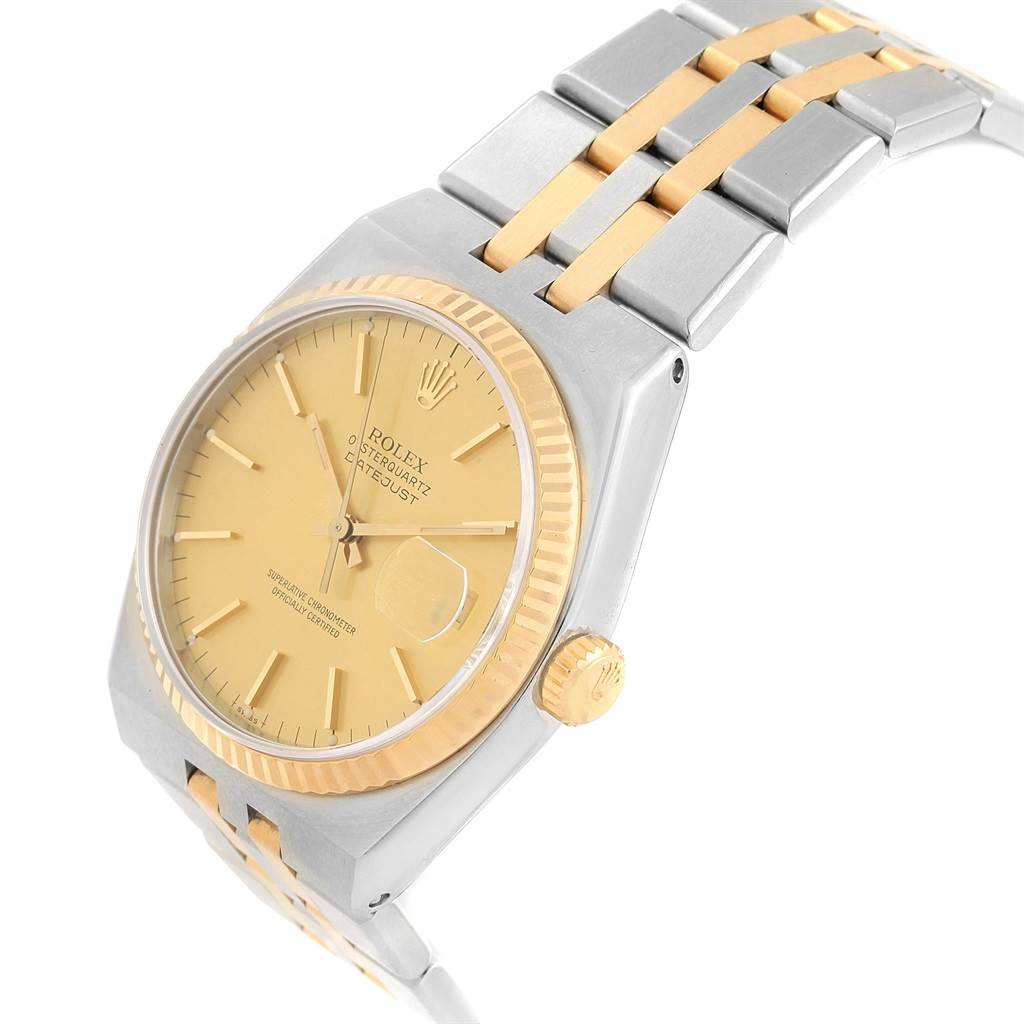 The Rolex Oysterquartz 17013 Men
s Stainless Steel Champagne Dial 17013 Men
s Stainless Steel Champagne Dial watch is shown at an angle displaying the face, crown, and a partial view of the bracelet.