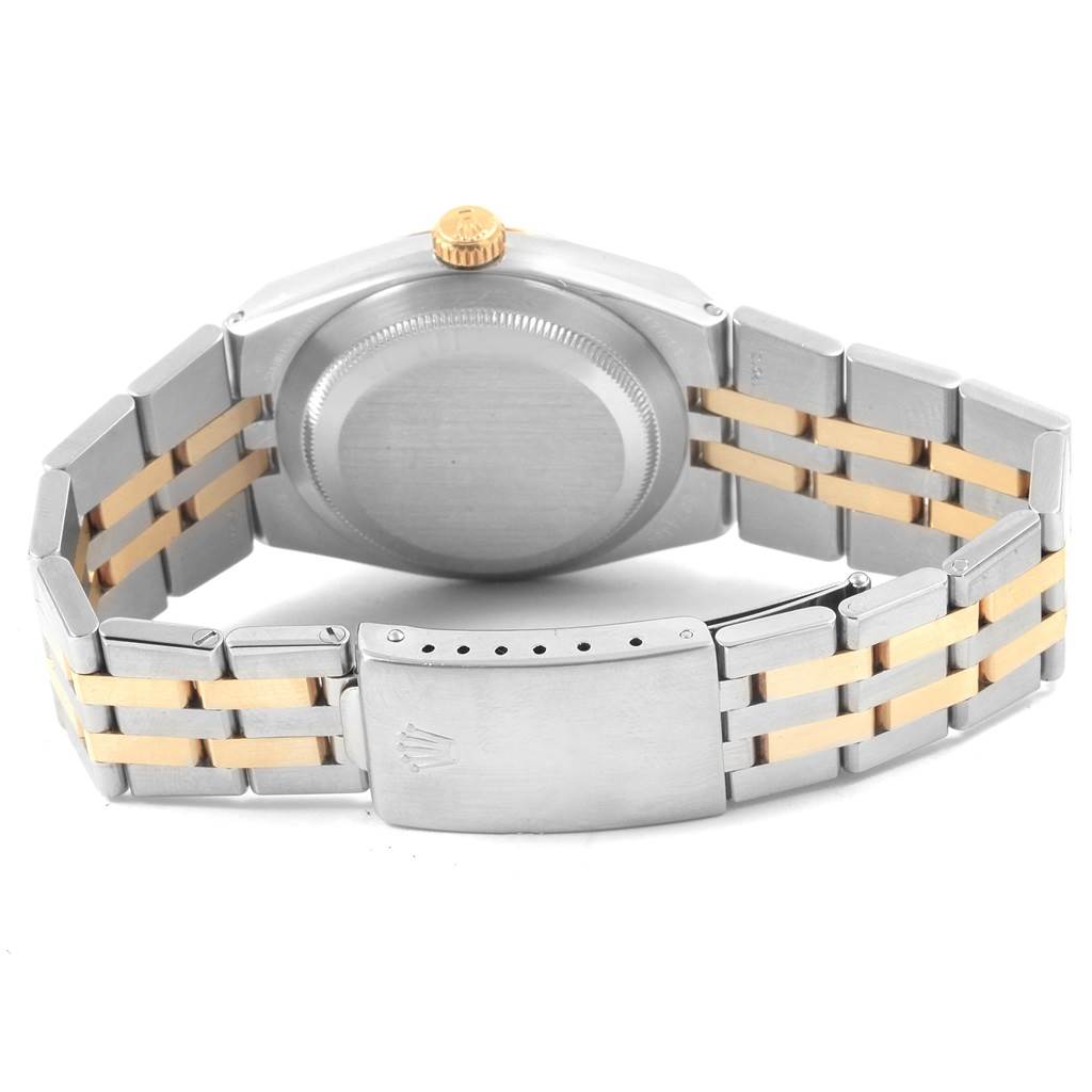 The image shows the back of a Rolex Oysterquartz 17013 Men
s Stainless Steel Silver Dial 17013 Men
s Stainless Steel Silver Dial watch, focusing on its case back, crown, and two-tone bracelet.