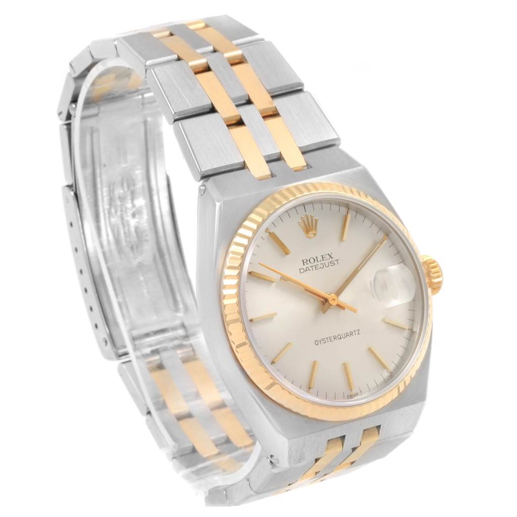 The Rolex Oysterquartz 17013 Men
s Stainless Steel Silver Dial 17013 Men
s Stainless Steel Silver Dial watch is shown at a three-quarter angle, displaying the face, bezel, bracelet, and clasp.