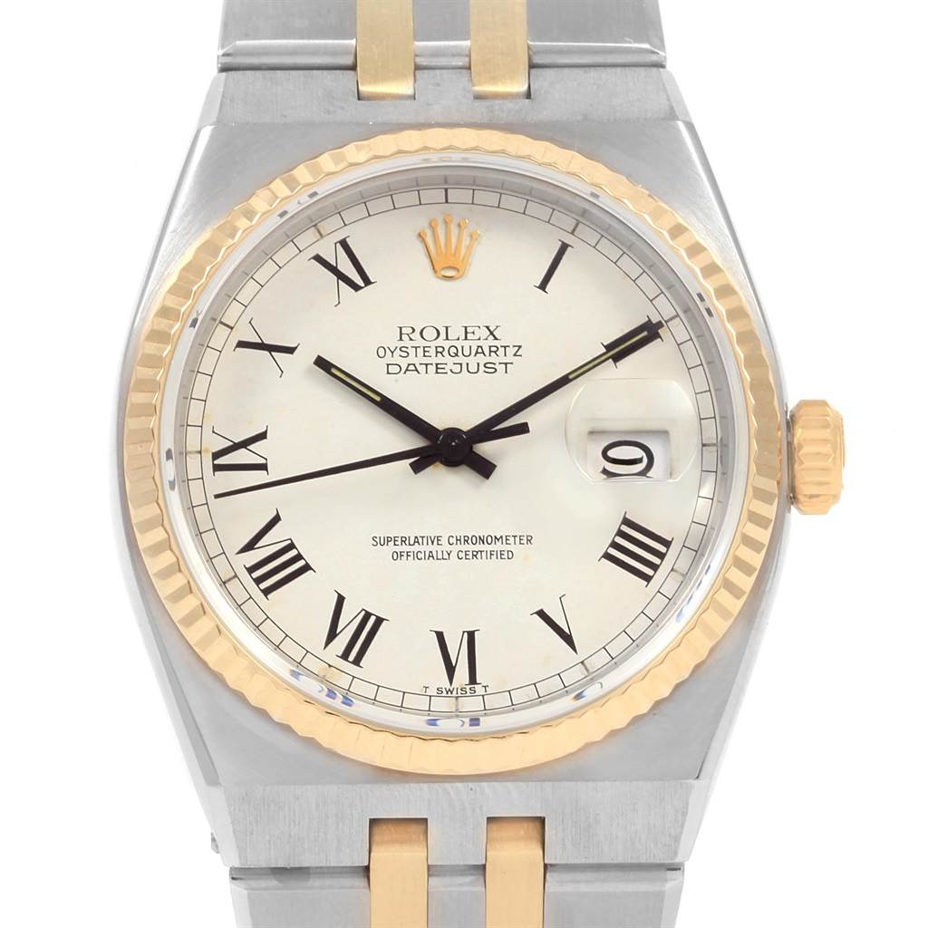 The image shows a front view of the Rolex Oysterquartz 17013 Men's Steel and Gold (two tone) White Dial 17013 Men's Steel and Gold (two tone) White Dial Datejust, displaying the dial, hands, bezel, and partial bracelet.