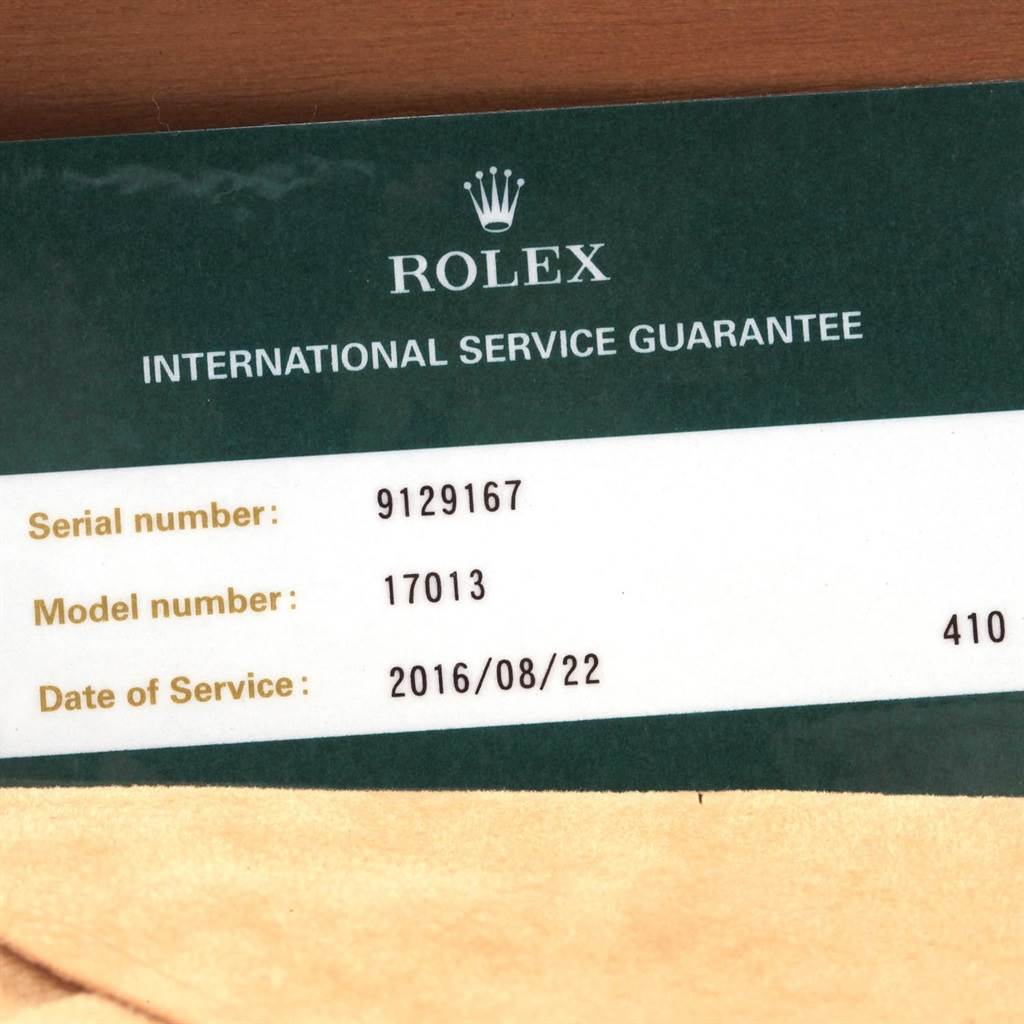 The image shows a Rolex International Service Guarantee card for a Rolex Oysterquartz 17013 Men
s Stainless Steel Champagne Dial 17013 Men
s Stainless Steel Champagne Dial model (17013) with the serial number 9129167.