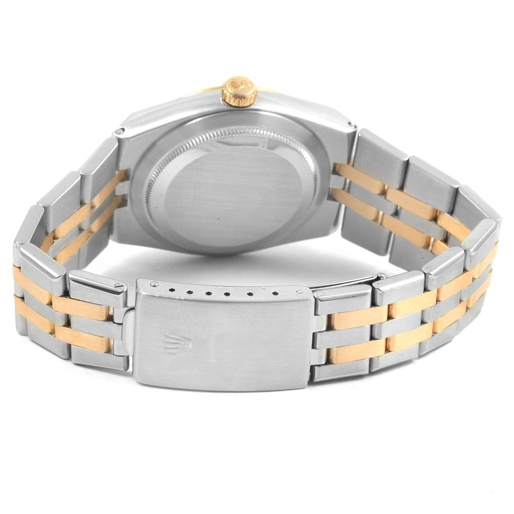 The image shows the back and bracelet of a Rolex Oysterquartz 17013 Men
s Stainless Steel Champagne Dial 17013 Men
s Stainless Steel Champagne Dial watch from a rear angle, highlighting its stainless steel and gold links.