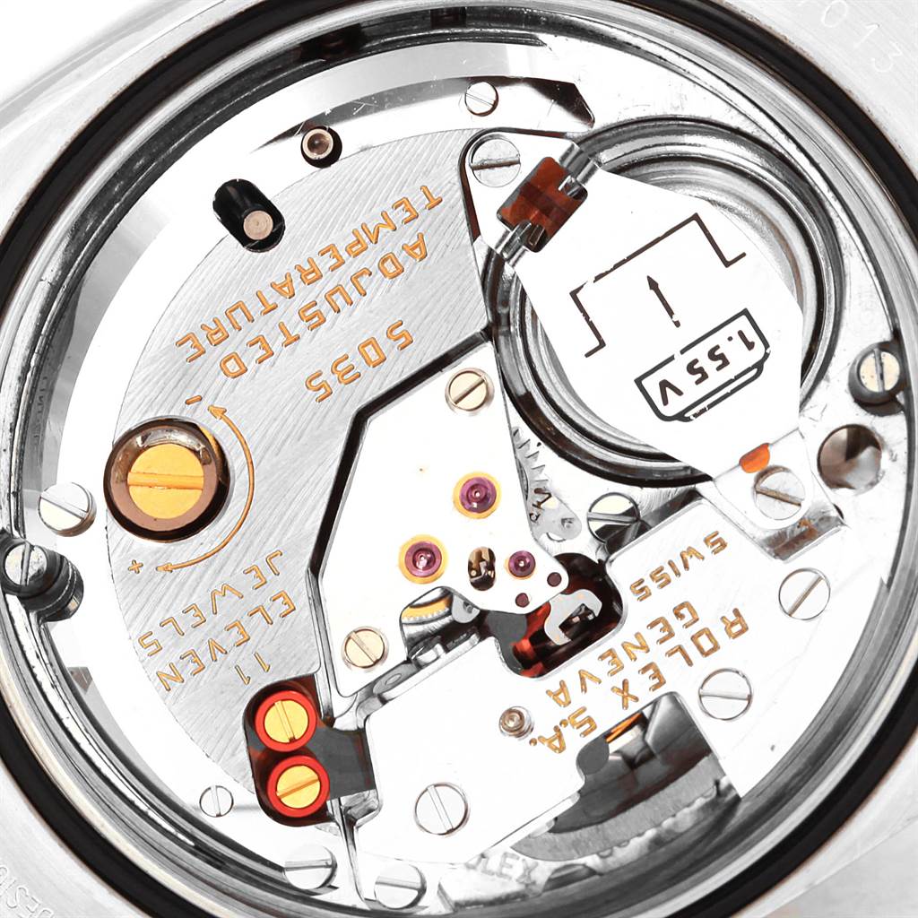 The image shows the internal mechanism of a Rolex Oysterquartz 17013 Men
s Stainless Steel Blue Dial 17013 Men
s Stainless Steel Blue Dial watch, viewed from the back with parts and inscriptions visible.