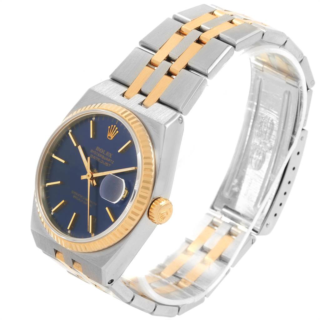 This Rolex Oysterquartz 17013 Men
s Stainless Steel Blue Dial 17013 Men
s Stainless Steel Blue Dial watch is shown at a three-quarter angle, highlighting the face, bracelet, and crown.