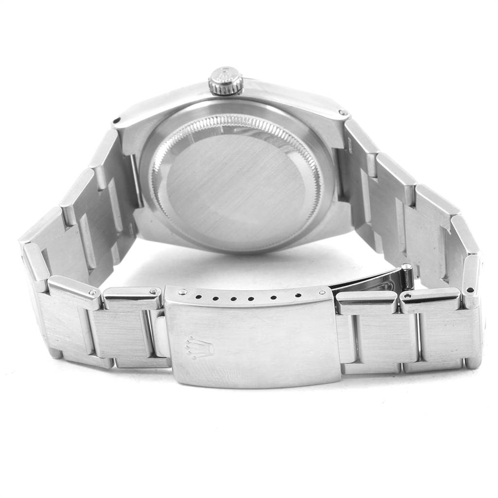 The image shows the back view of a Rolex Oysterquartz 17000 Men
s Stainless Steel White Dial 17000 Men
s Stainless Steel White Dial watch, highlighting the case back, crown, and metal bracelet with a clasp.