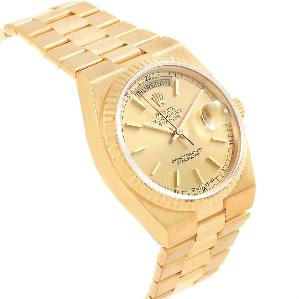 The image shows a side angle of the Rolex Oysterquartz 19018 Men
s Yellow Gold Champagne Dial 19018 Men
s Yellow Gold Champagne Dial watch, featuring its golden case, fluted bezel, bracelet, and visible crown.