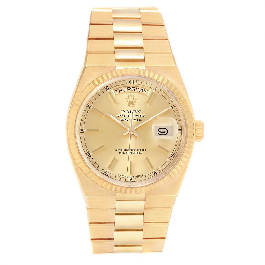 The image shows a front view of a Rolex Oysterquartz 19018 Men
s Yellow Gold Champagne Dial 19018 Men
s Yellow Gold Champagne Dial watch, displaying the dial, day, date, bezel, and part of the bracelet.