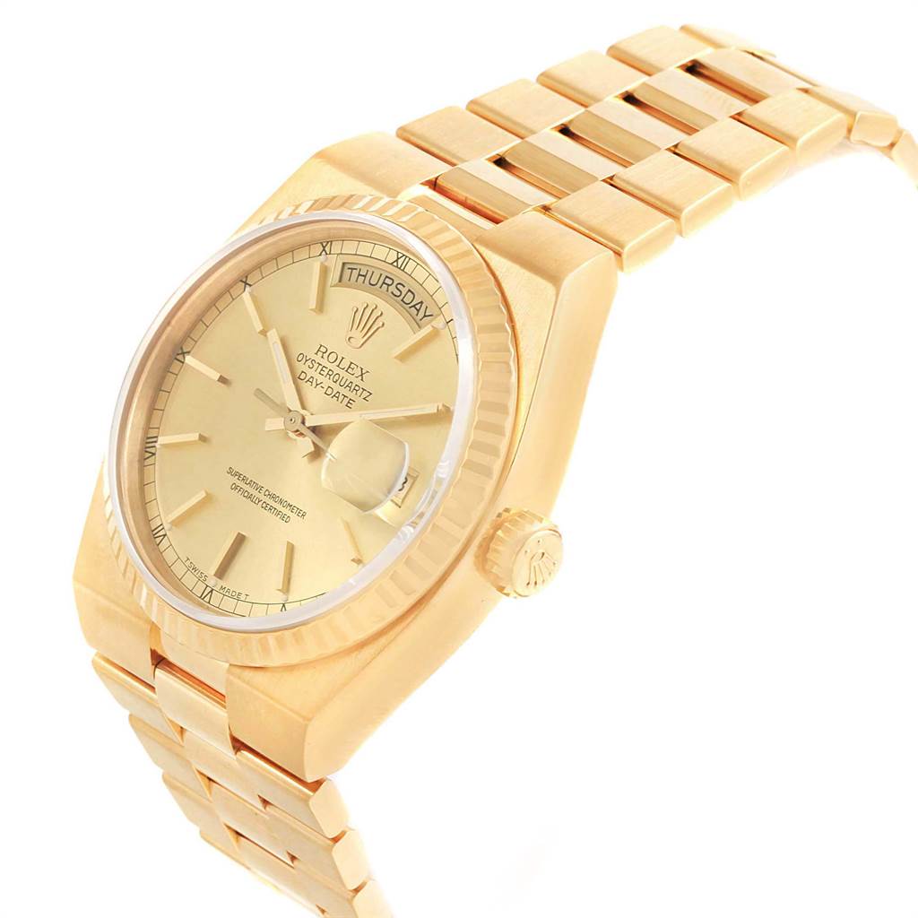 This image showcases a Rolex Oysterquartz 19018 Men
s Yellow Gold Champagne Dial 19018 Men
s Yellow Gold Champagne Dial watch at an angled side view, highlighting its dial, crown, and part of the bracelet.