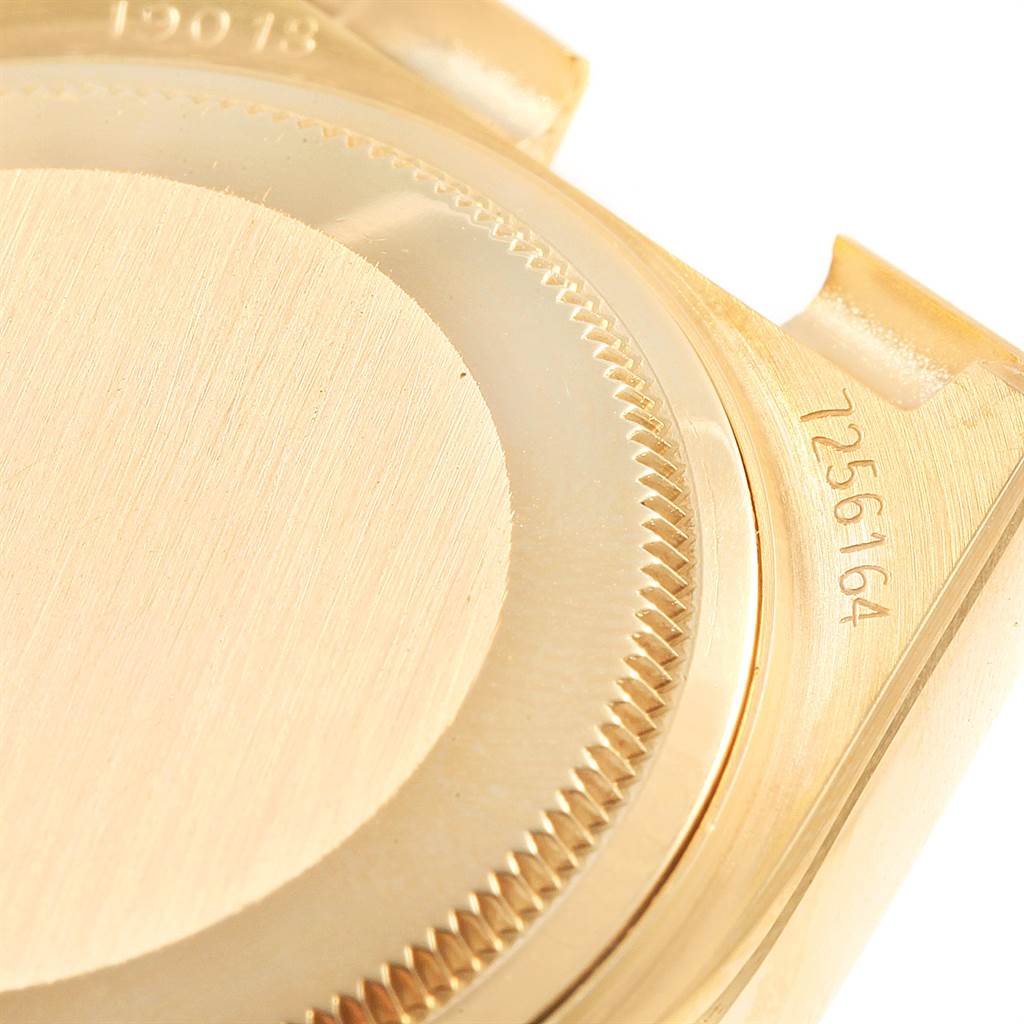 The image shows a close-up of the back case and side details of a Rolex Oysterquartz 19018 Men
s Yellow Gold Champagne Dial 19018 Men
s Yellow Gold Champagne Dial watch.