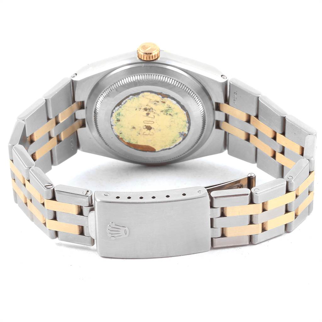 The image shows the back view of a Rolex Oysterquartz 21993 Men
s Stainless Steel Silver Dial 21993 Men
s Stainless Steel Silver Dial watch, including its case back, crown, and bracelet with clasp.