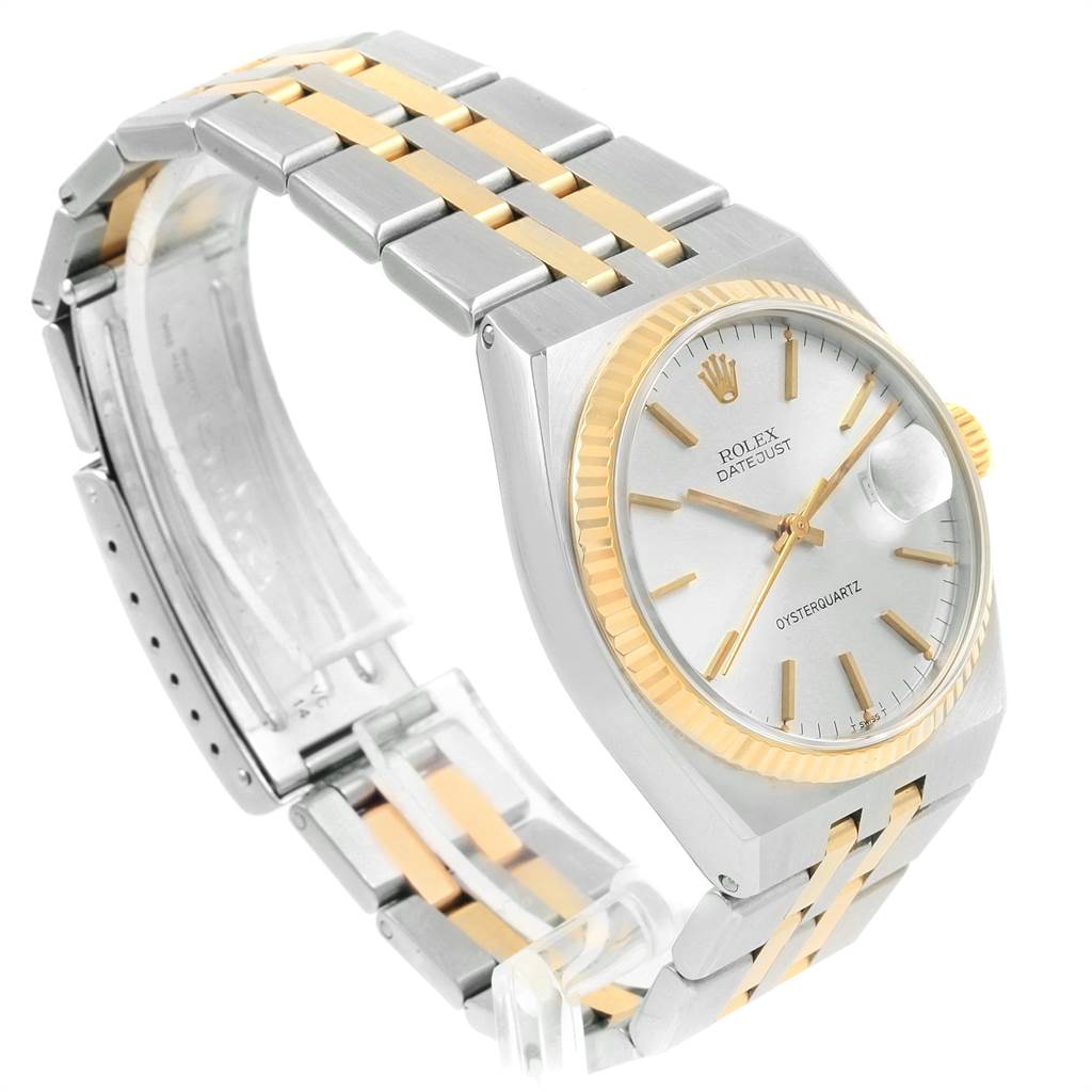 This image shows a side angle of the Rolex Oysterquartz 21993 Men
s Stainless Steel Silver Dial 21993 Men
s Stainless Steel Silver Dial watch, highlighting the stainless steel and gold bracelet, and the white dial.