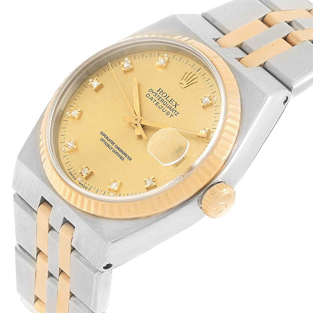 The Rolex Oysterquartz 17013 Men's Stainless Steel Champagne Dial 17013 Men's Stainless Steel Champagne Dial watch is shown at a slight angle, featuring the gold and steel case, dial, fluted bezel, and part of the bracelet.