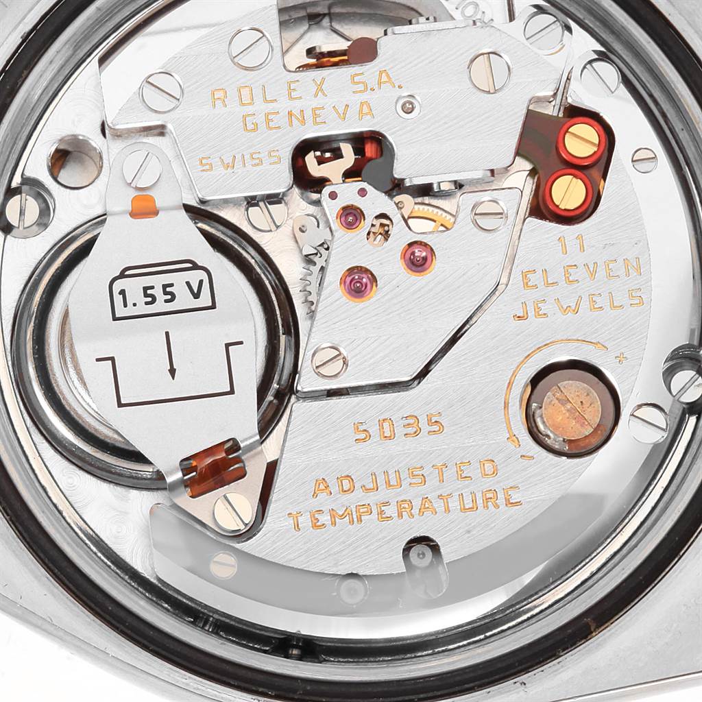 The image shows the inner mechanism of a Rolex Oysterquartz 17013 Men's Stainless Steel Champagne Dial 17013 Men's Stainless Steel Champagne Dial model, highlighting its components like the battery, jewels, and calibration markings.