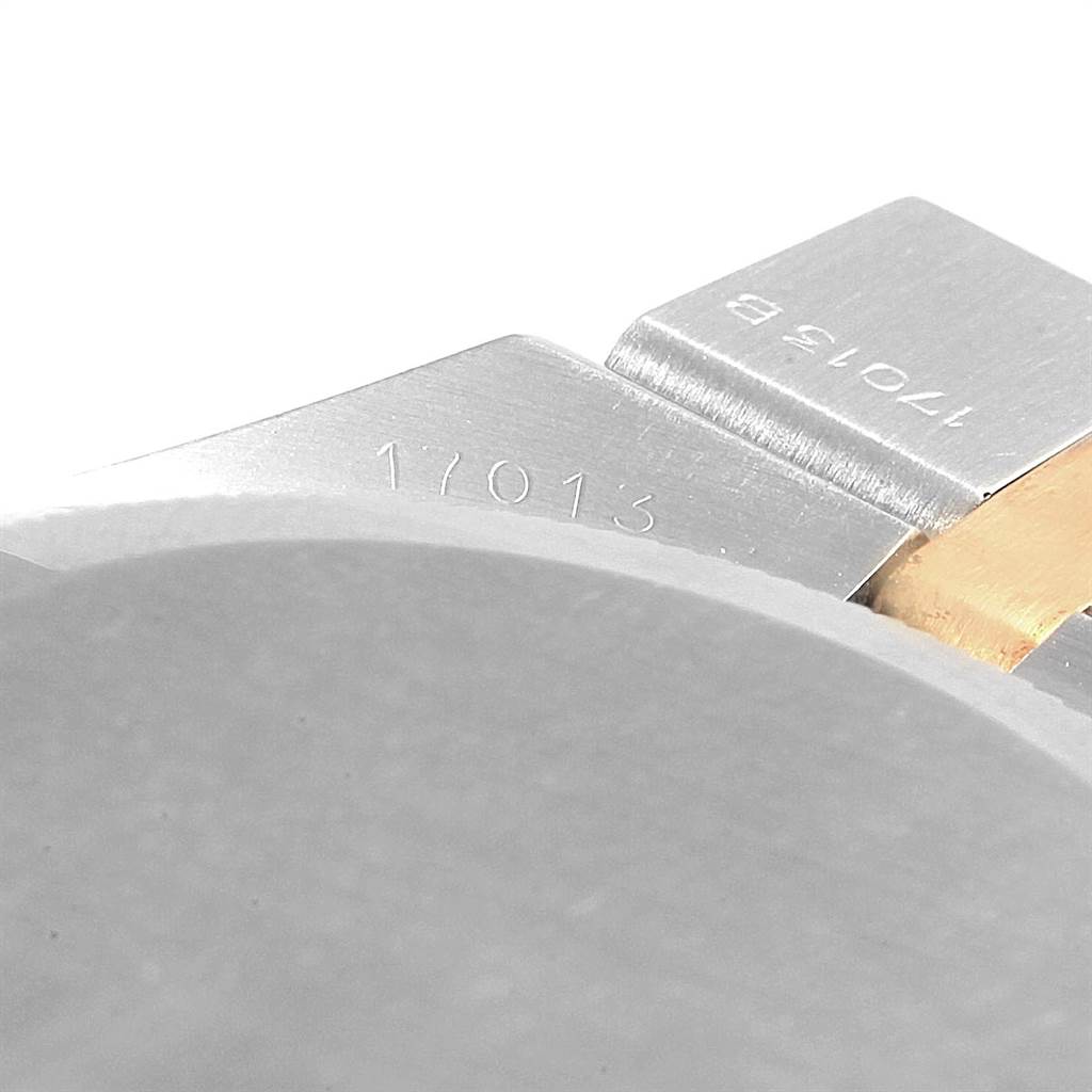 This close-up image shows the side view of the Rolex Oysterquartz 17013 Men's Stainless Steel Champagne Dial 17013 Men's Stainless Steel Champagne Dial model, featuring the engraved model number on the case.