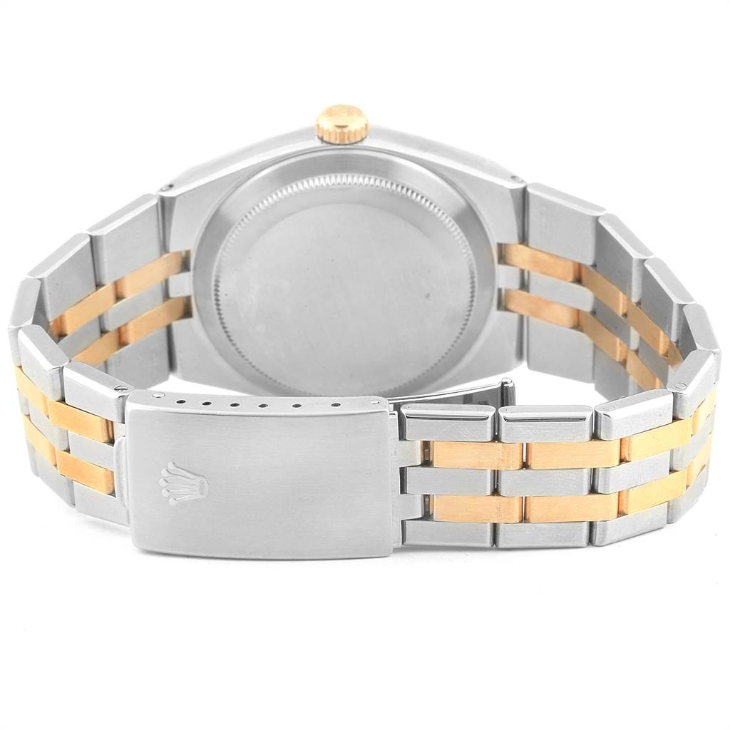 The image shows the back view of a Rolex Oysterquartz 17013 Men's Stainless Steel Champagne Dial 17013 Men's Stainless Steel Champagne Dial watch, highlighting its case back, crown, and bi-tone bracelet.