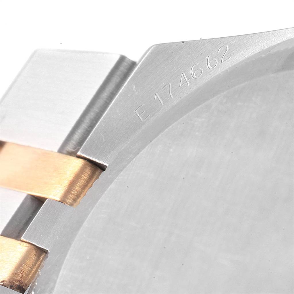 The image shows a close-up of the Rolex Oysterquartz 17013 Men's Stainless Steel Champagne Dial 17013 Men's Stainless Steel Champagne Dial watch's bracelet and part of the case with the serial number.