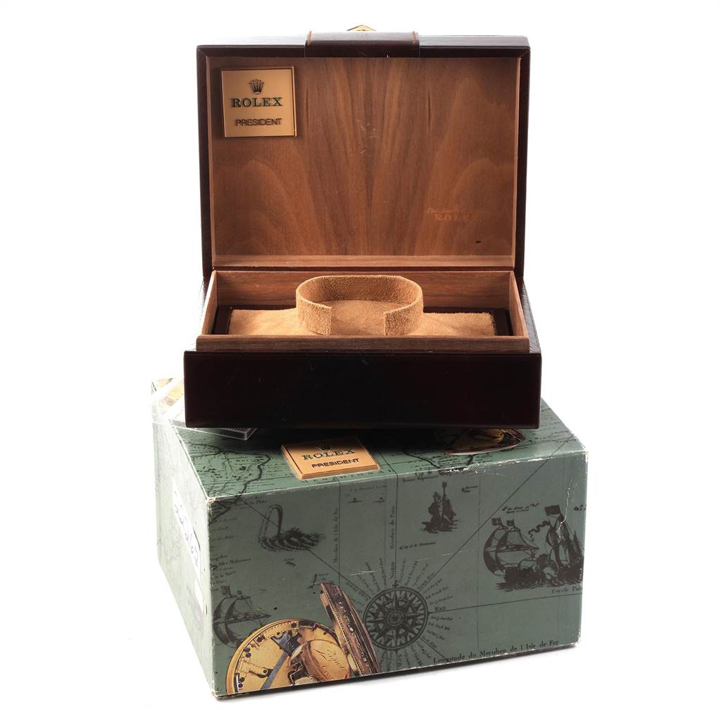 The image shows an open wooden Rolex Oysterquartz 19018 Men's Yellow Gold White Dial 19018 Men's Yellow Gold White Dial watch box sitting on a decorative green exterior box.