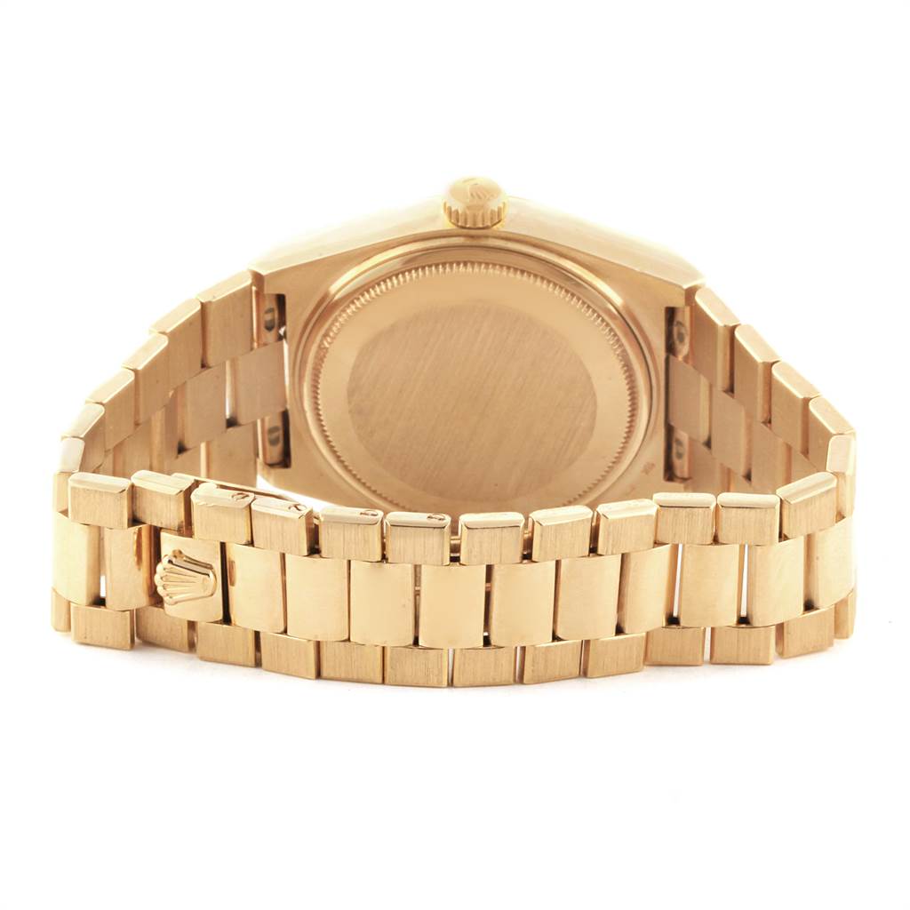 This image shows the back view of a Rolex Oysterquartz 19018 Men's Yellow Gold White Dial 19018 Men's Yellow Gold White Dial watch, highlighting the case back, crown, and bracelet with the Rolex logo.