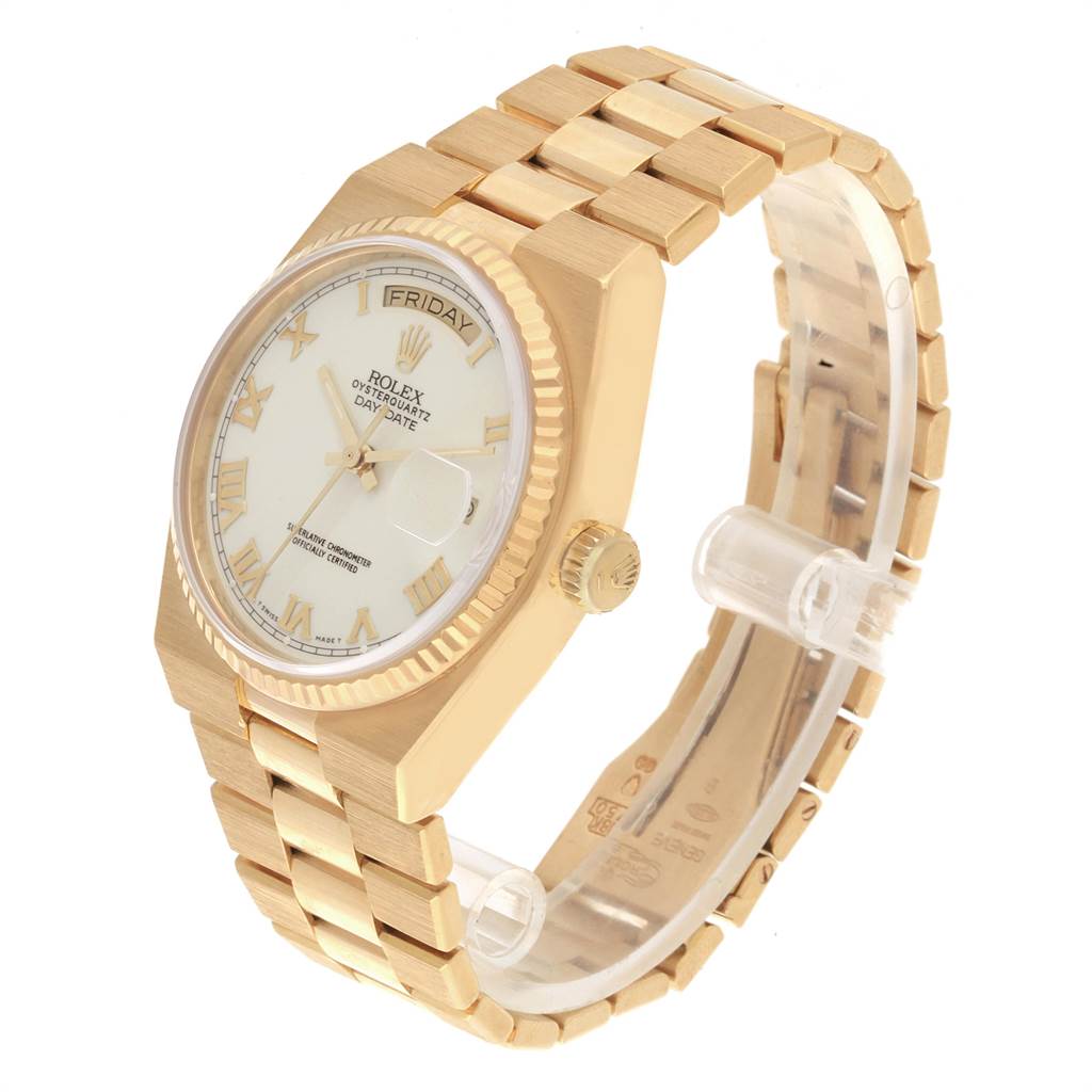The image shows a Rolex Oysterquartz 19018 Men's Yellow Gold White Dial 19018 Men's Yellow Gold White Dial Day-Date watch at a three-quarter angle, highlighting its golden case, dial, and bracelet.