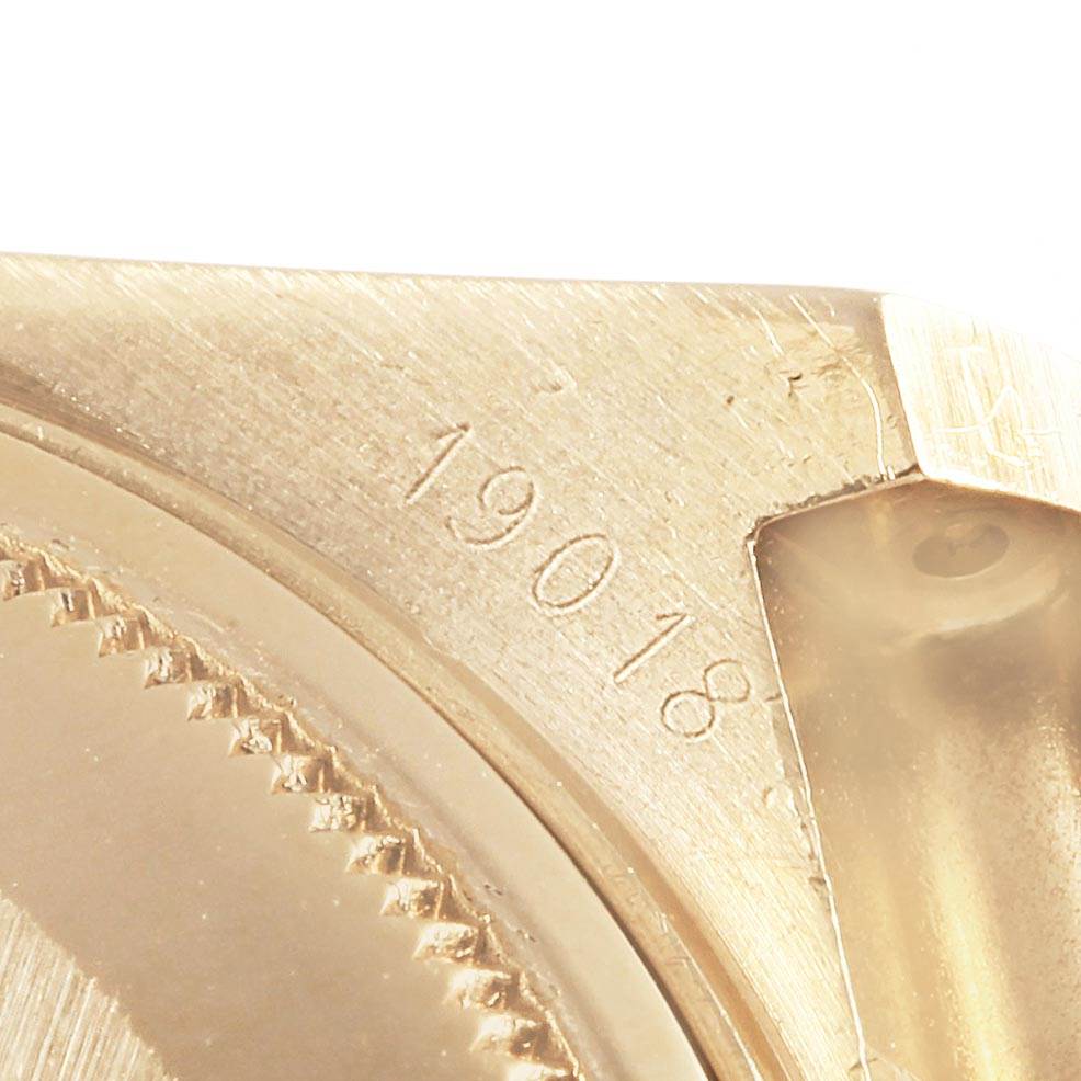 This image shows a close-up of the case back and reference number of a Rolex Oysterquartz 19018 Men's Yellow Gold White Dial 19018 Men's Yellow Gold White Dial model.
