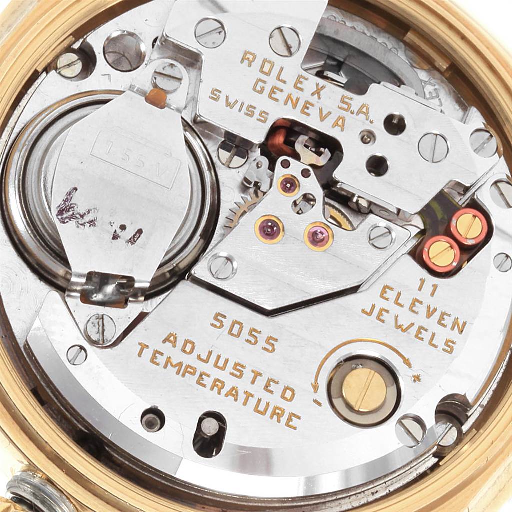 The image shows the internal mechanism and components of a Rolex Oysterquartz 19018 Men's Yellow Gold White Dial 19018 Men's Yellow Gold White Dial watch, displaying its intricate details and engravings.