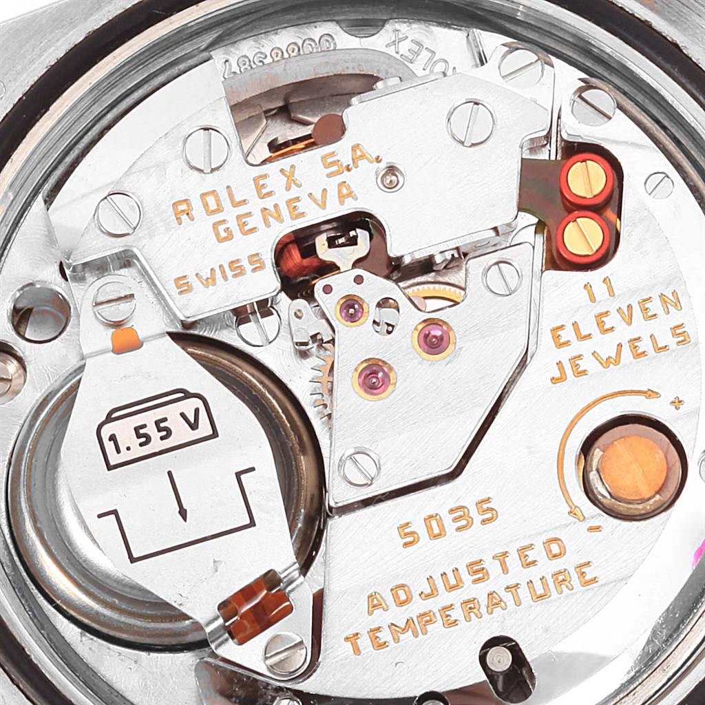 This image shows the internal mechanism of a Rolex Oysterquartz 17000 Men's Stainless Steel White Dial 17000 Men's Stainless Steel White Dial watch, focusing on the movement and battery compartment.