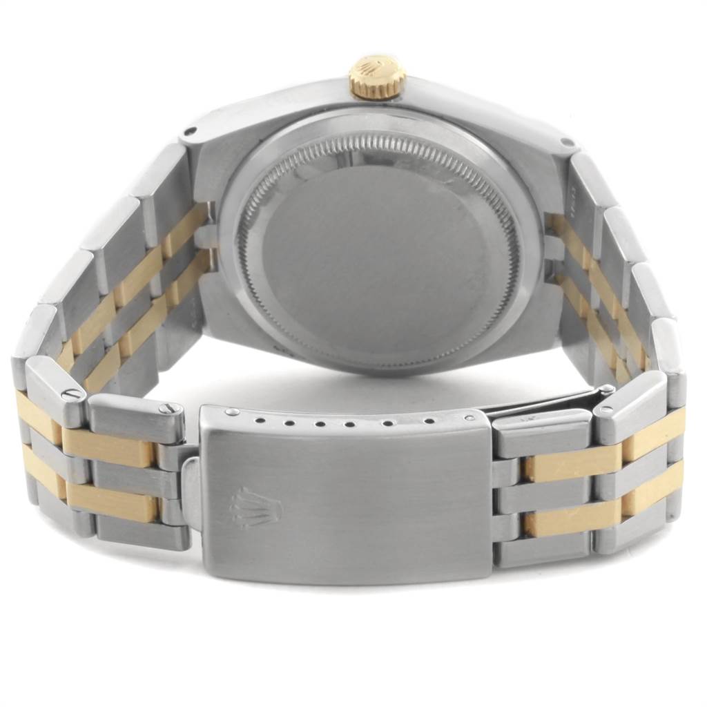 The image shows the back of a Rolex Oysterquartz 17013 Men's Steel and Gold (two tone) White Dial 17013 Men's Steel and Gold (two tone) White Dial watch, highlighting its case, crown, and the closing clasp of the bracelet.