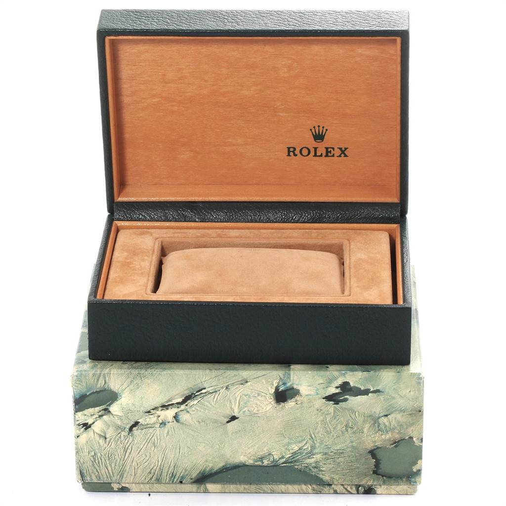 This image shows the open box for a Rolex Oysterquartz 17013 Men
s Stainless Steel Champagne Dial 17013 Men
s Stainless Steel Champagne Dial watch, with a tan cushion inside.