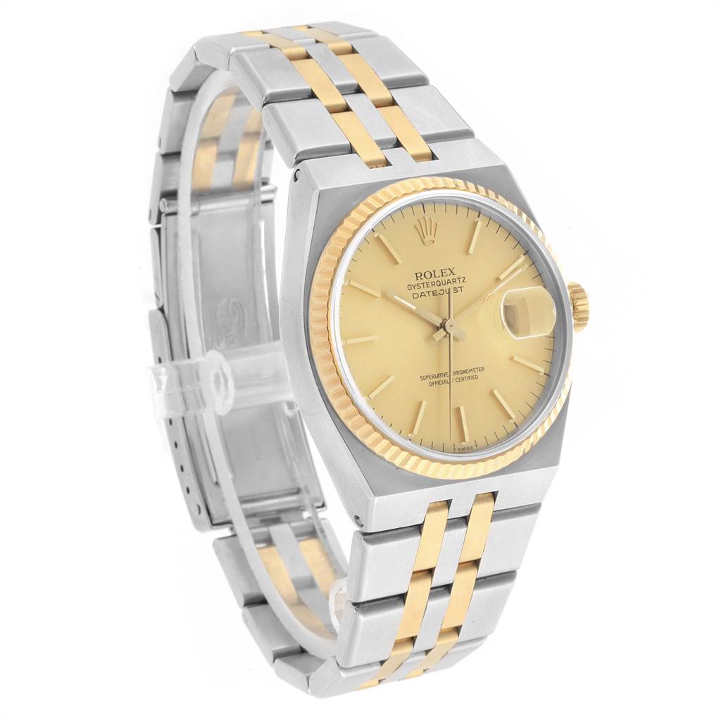 The Rolex Oysterquartz 17013 Men
s Stainless Steel Champagne Dial 17013 Men
s Stainless Steel Champagne Dial watch is shown at a three-quarter angle, highlighting the dial, fluted bezel, and two-tone bracelet.