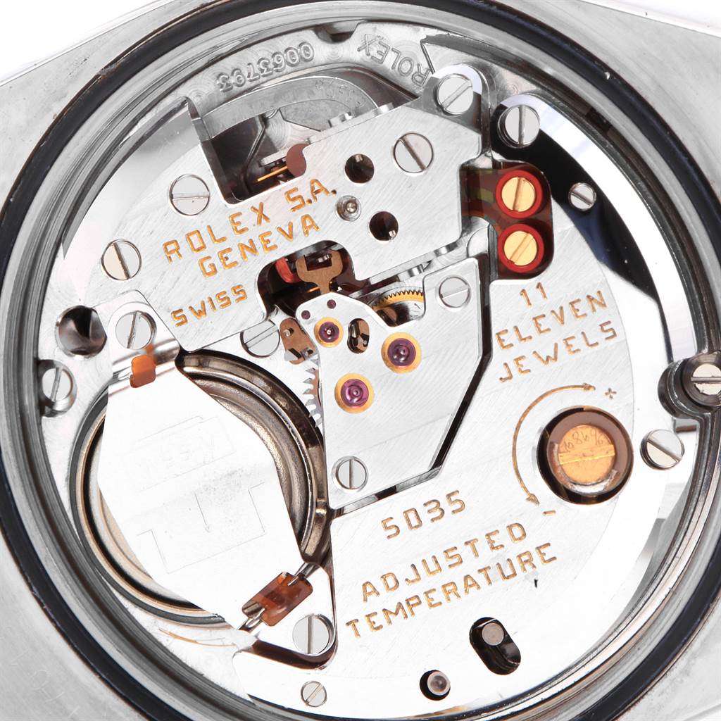 This image shows the inner mechanics and movement of a Rolex Oysterquartz 17013 Men
s Stainless Steel Black Dial 17013 Men
s Stainless Steel Black Dial watch, highlighting its components and engravings.