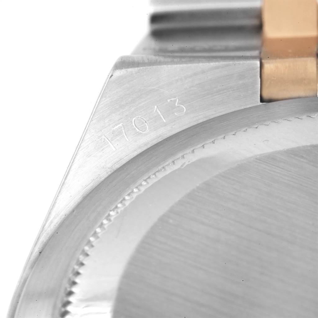 This close-up image shows the model number "17013" engraved on the case of a Rolex Oysterquartz 17013 Men
s Stainless Steel Black Dial 17013 Men
s Stainless Steel Black Dial watch.
