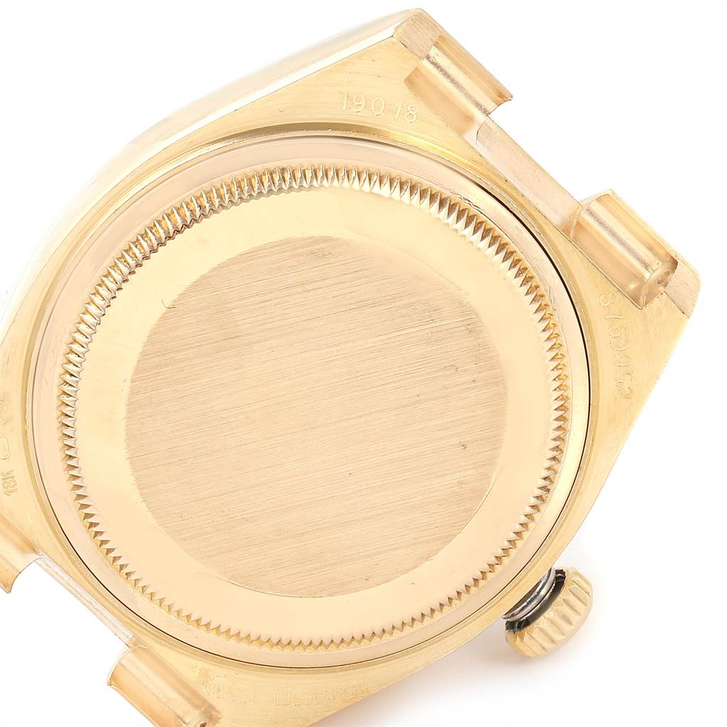 The image shows the back case and crown of a Rolex Oysterquartz 19018 Men's Yellow Gold Champagne Dial 19018 Men's Yellow Gold Champagne Dial watch from a top-down angle.