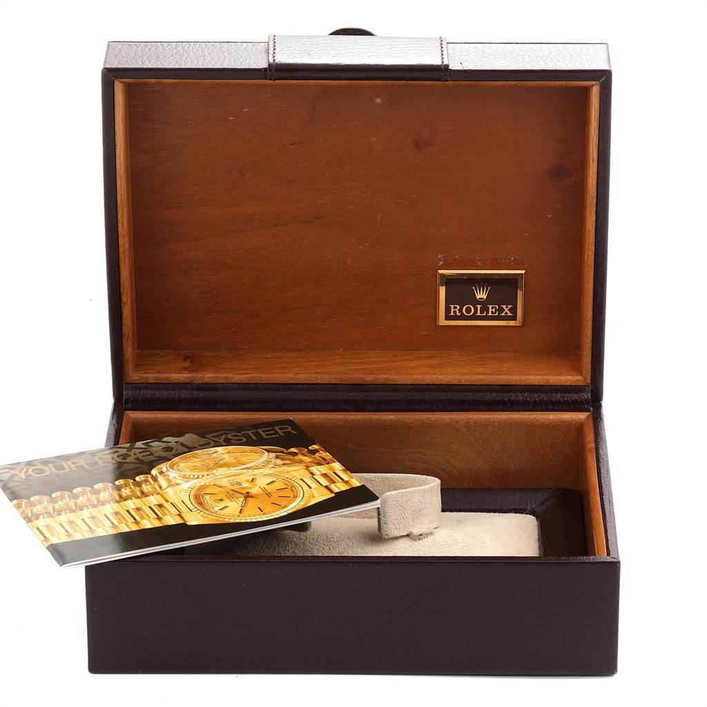 The image shows an open Rolex Oysterquartz 19018 Men's Yellow Gold Champagne Dial 19018 Men's Yellow Gold Champagne Dial watch box with a booklet and pillow inside.
