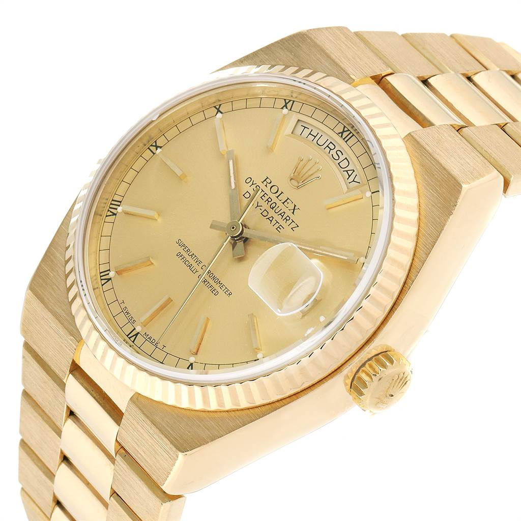 The image shows a close-up angle of the Rolex Oysterquartz 19018 Men's Yellow Gold Champagne Dial 19018 Men's Yellow Gold Champagne Dial watch displaying its dial, crown, and part of the bracelet.