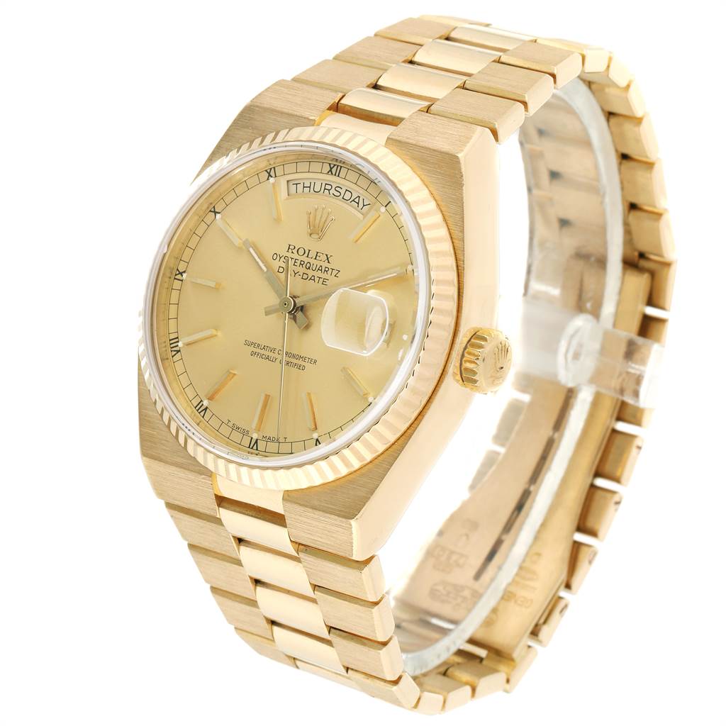 The Rolex Oysterquartz 19018 Men's Yellow Gold Champagne Dial 19018 Men's Yellow Gold Champagne Dial watch is shown at a three-quarter angle, displaying the dial, bezel, crown, and bracelet links.