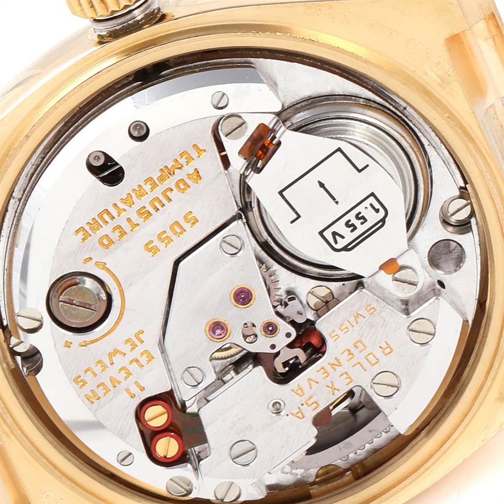 The image shows the movement of a Rolex Oysterquartz 19018 Men's Yellow Gold Champagne Dial 19018 Men's Yellow Gold Champagne Dial watch from the back with visible components and mechanisms.