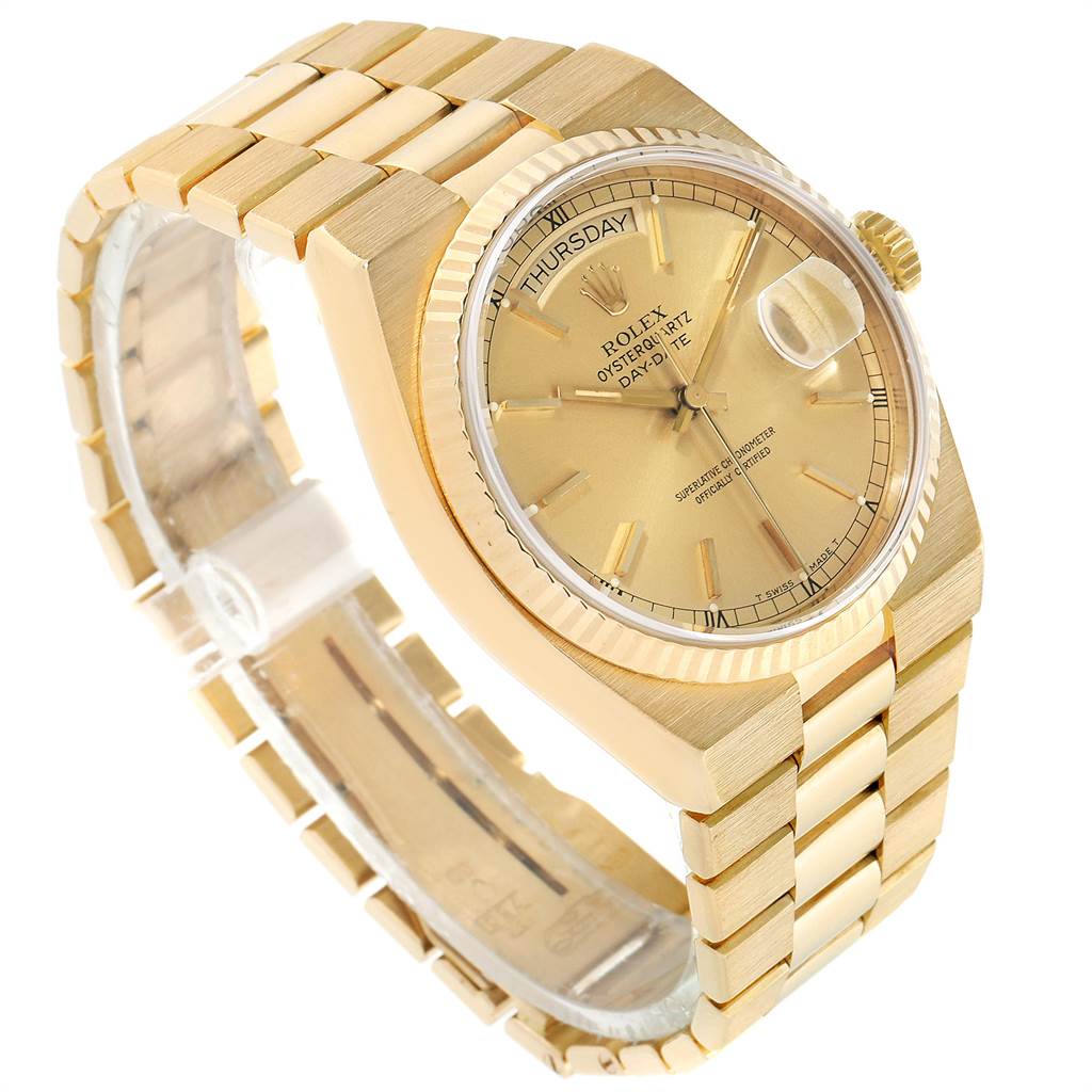 The image shows a side angle of a Rolex Oysterquartz 19018 Men's Yellow Gold Champagne Dial 19018 Men's Yellow Gold Champagne Dial watch, highlighting its gold bracelet, textured bezel, and day-date dial.